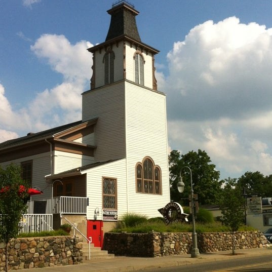 The white clapboard church with its bell tower on Main Street