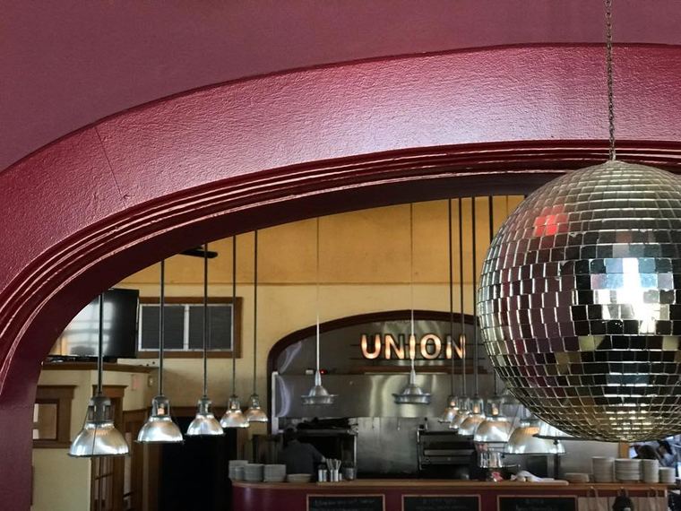 A disco ball in a Gothic arch