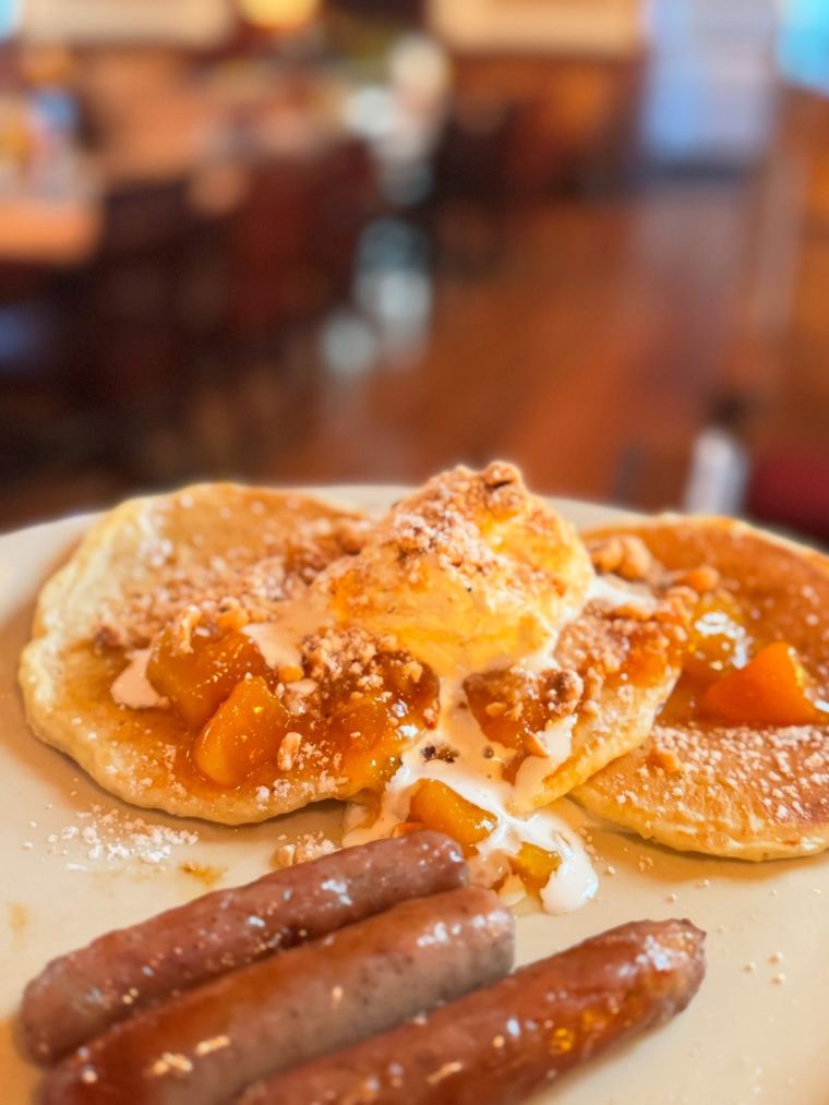 Brunch plate with pancakes and breakfast sausage