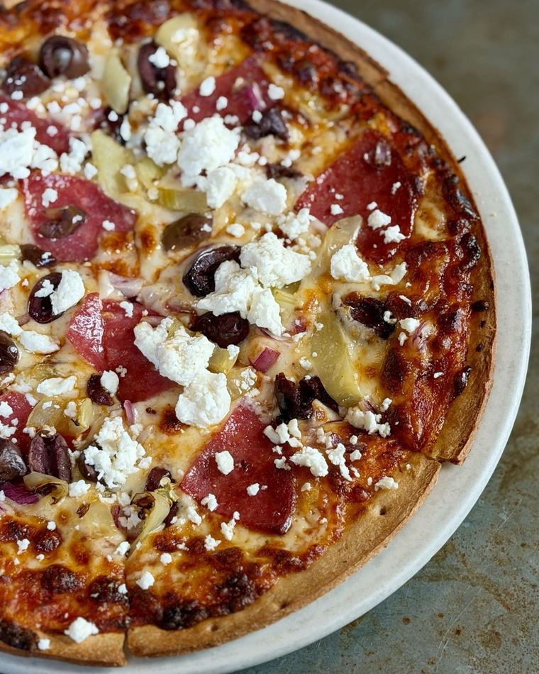 Cracker-crust pizza with feta, olives and chilies