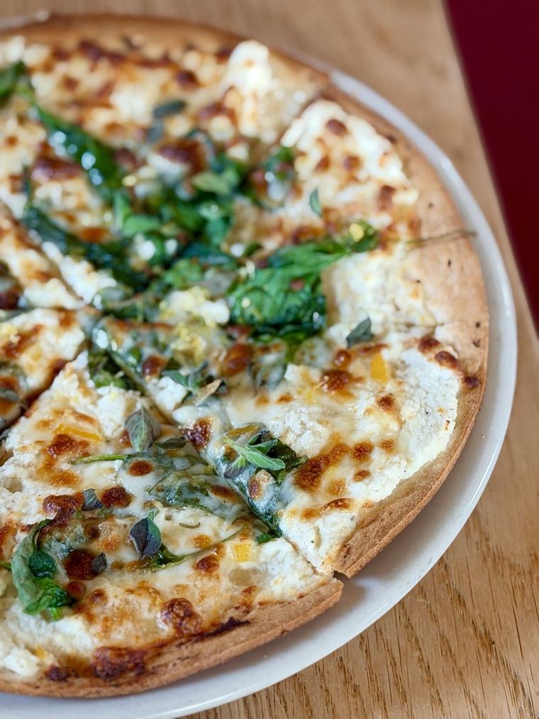 White pizza with spinach and preserved lemon