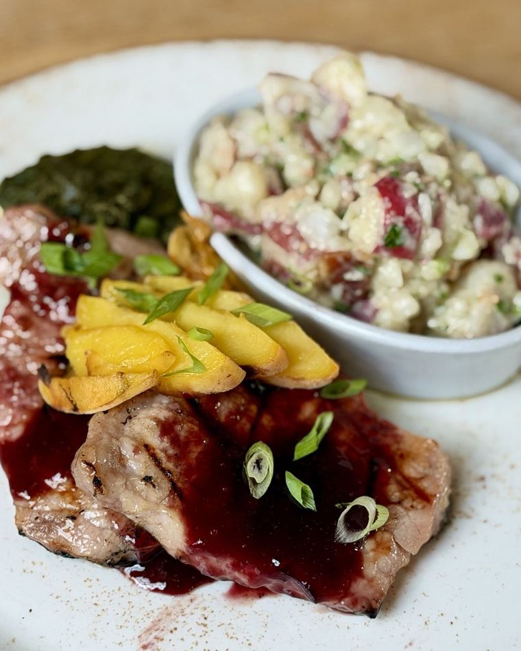 A chop, glazed, with a side of slaw