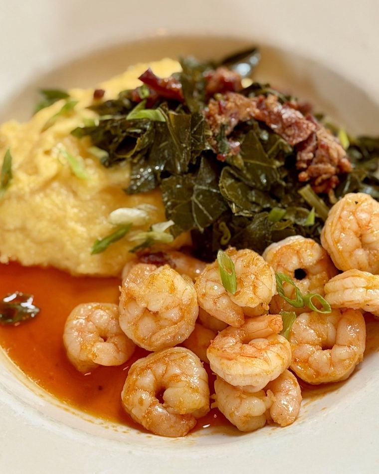 Shrimp over cheddar grits with collard greens